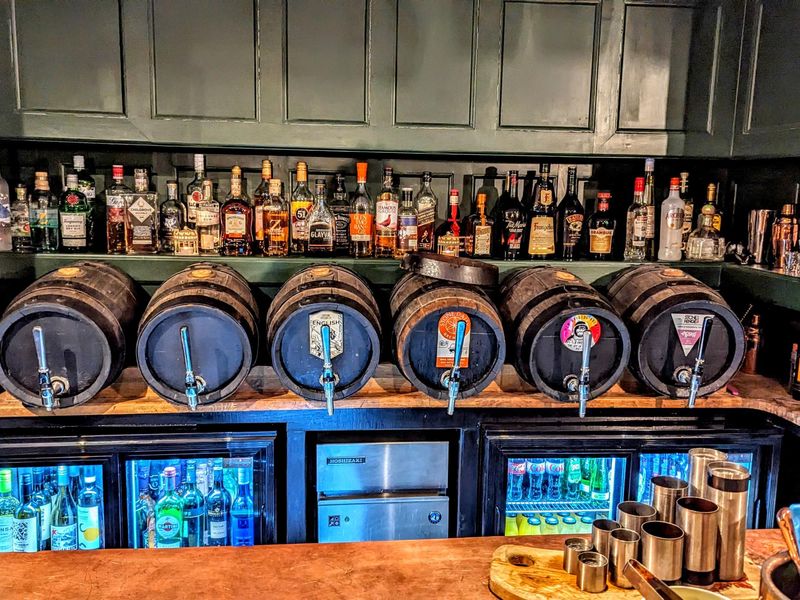 Jan 2024 - Cask ales dispensed though 'fake' barrels behind bar. (Bar). Published on 21-01-2024