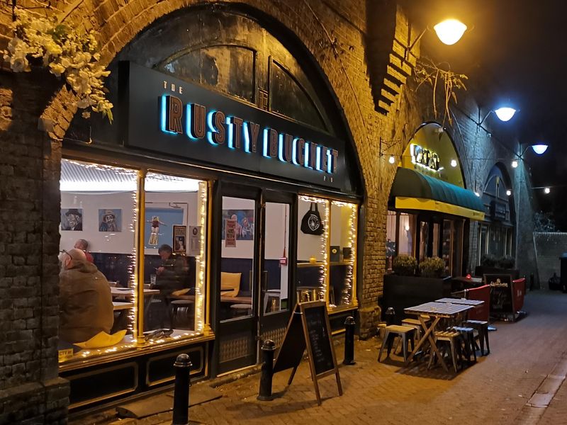 Pub exterior beneath the arch by night. (Pub, External, Sign, Key). Published on 28-01-2025