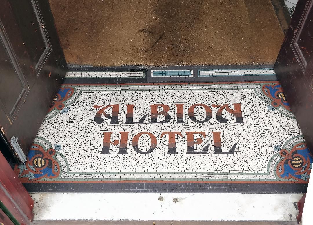 Mosaic of former name in entrance. (Pub). Published on 03-05-2019