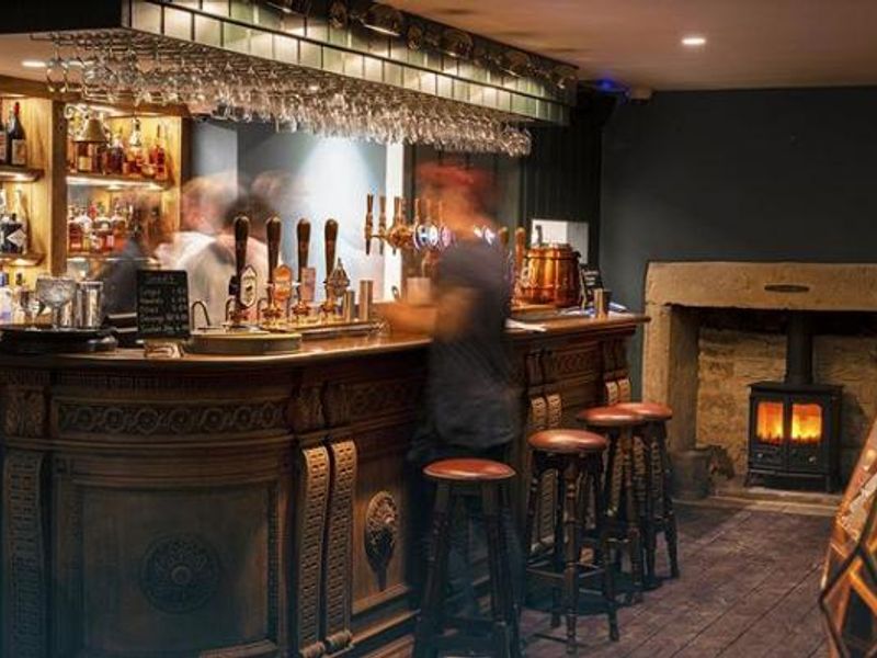 Copper-topped bar counter and wood-burning stove. (Bar). Published on 01-03-2020