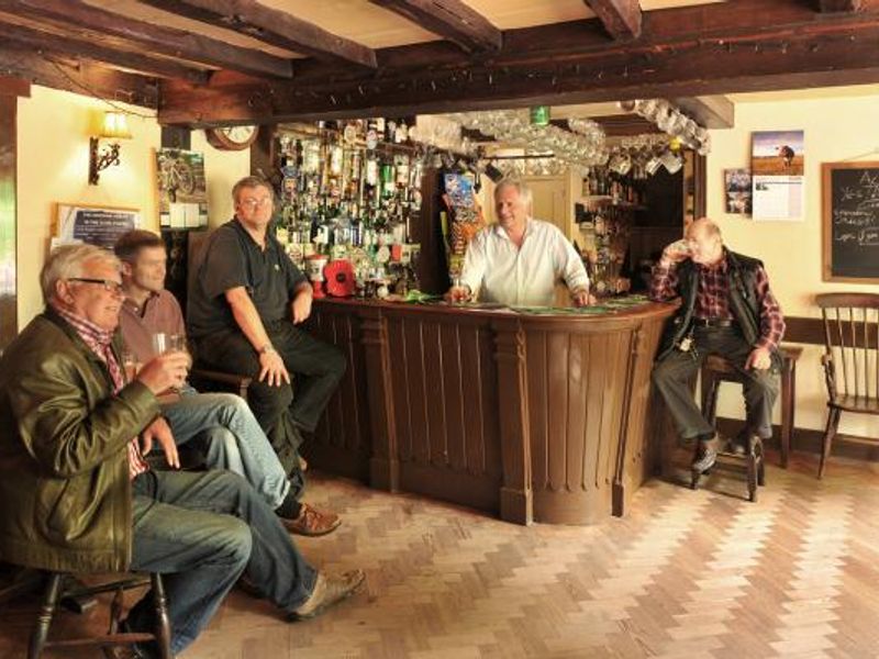 Bar and an array of customers. (Pub, Bar, Publican, Customers). Published on 27-05-2015 