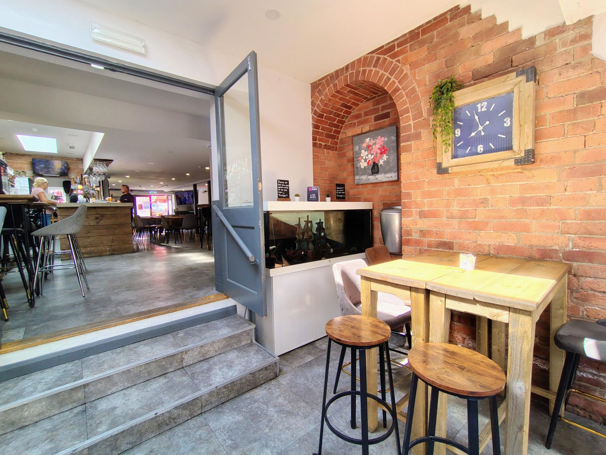 Stairs leading to rear seating area.. (Pub). Published on 16-08-2026