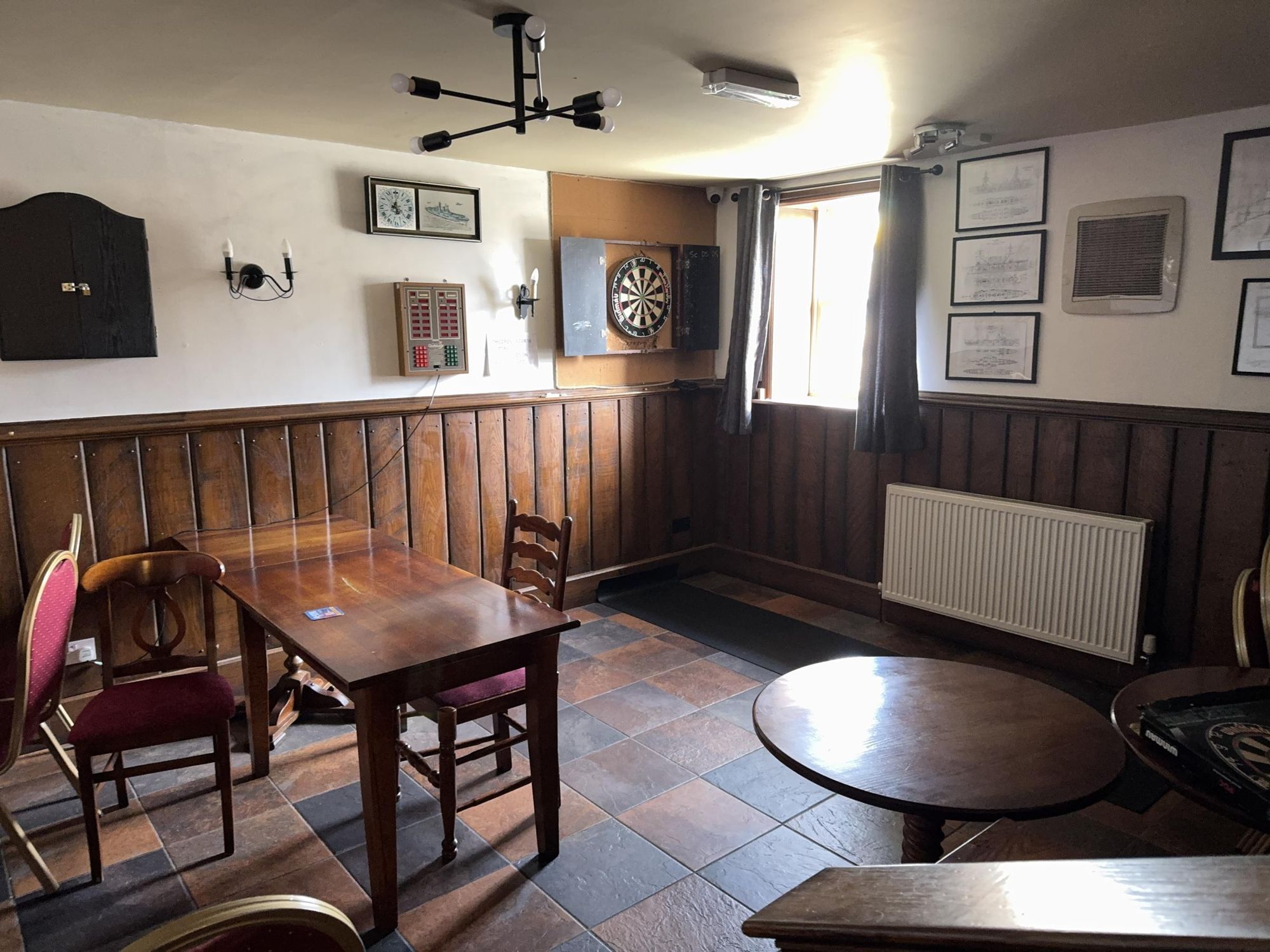 Darts and seating (9/04/2026 Ann Summers-Glass). (Pub, Bar). Published on 11-04-2026