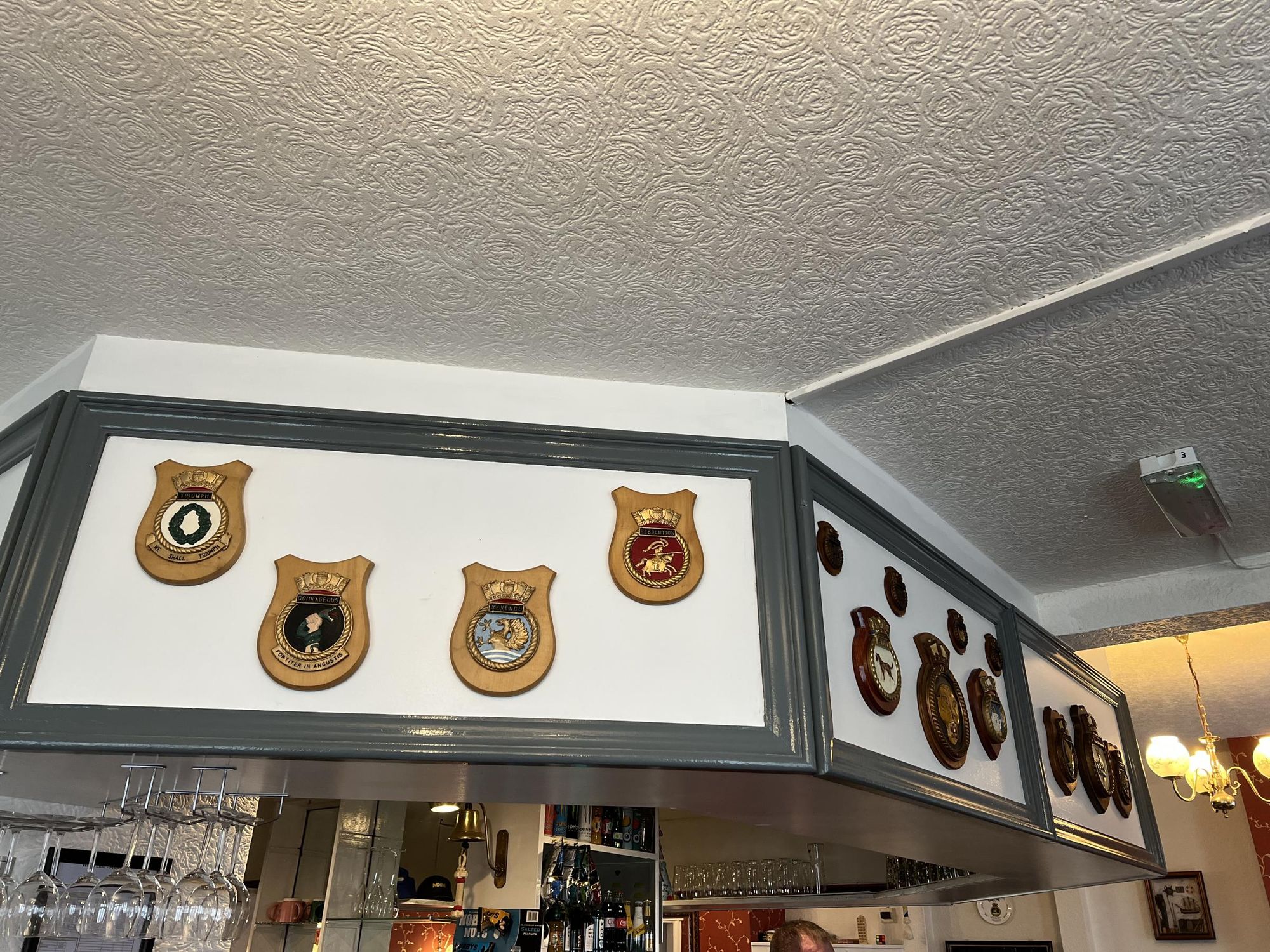 Ships crests above the bar (26/09/2025 Ann S-G). (Pub, Bar). Published on 28-09-2025