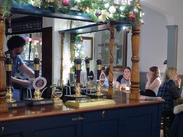 A busy night around the bar. (Pub, Bar, Customers). Published on 29-12-2015