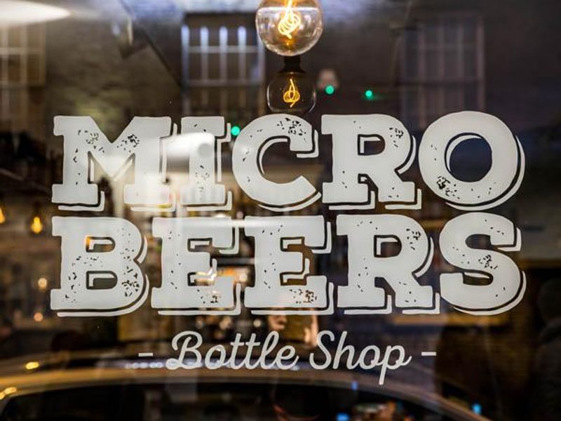 Logo on shop window. (External). Published on 10-02-2019