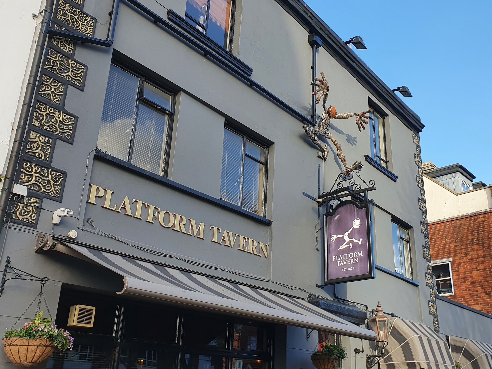 Platform Tavern signs and the 'dancing man' - 21/02/2022. (Pub, External, Sign). Published on 21-02-2022