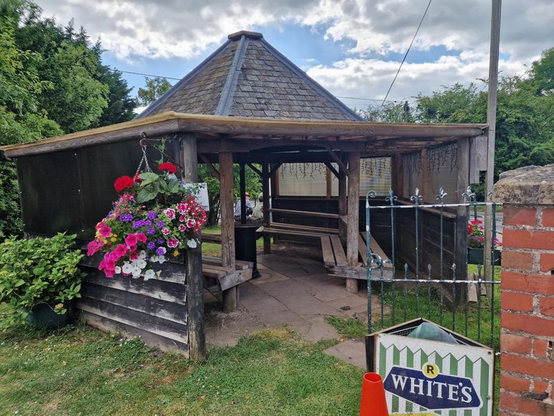 Smoking shelter and hanging baskets. (External, Garden). Published on 25-06-2024