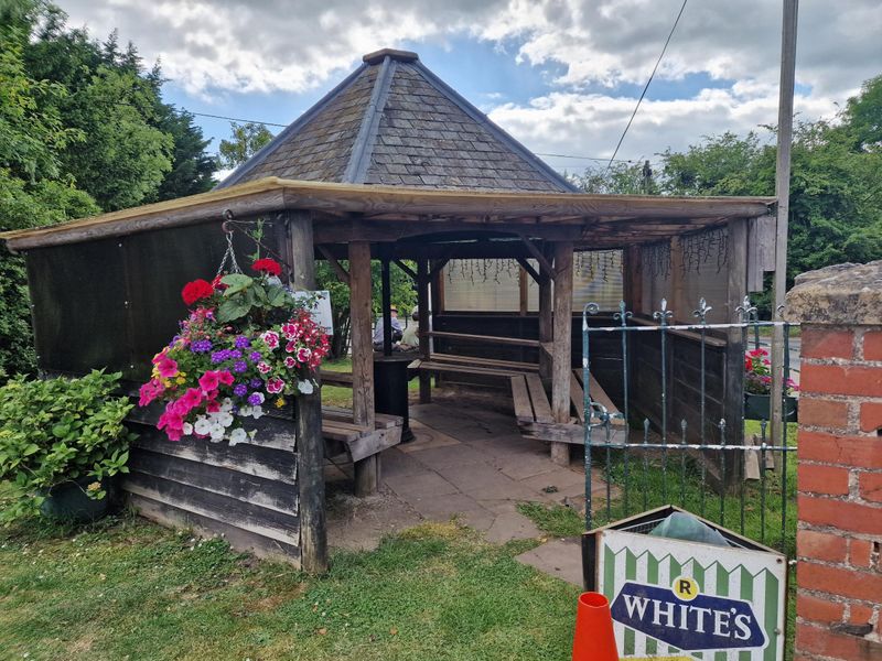 Smoking shelter and hanging baskets. (External, Garden). Published on 25-06-2024 