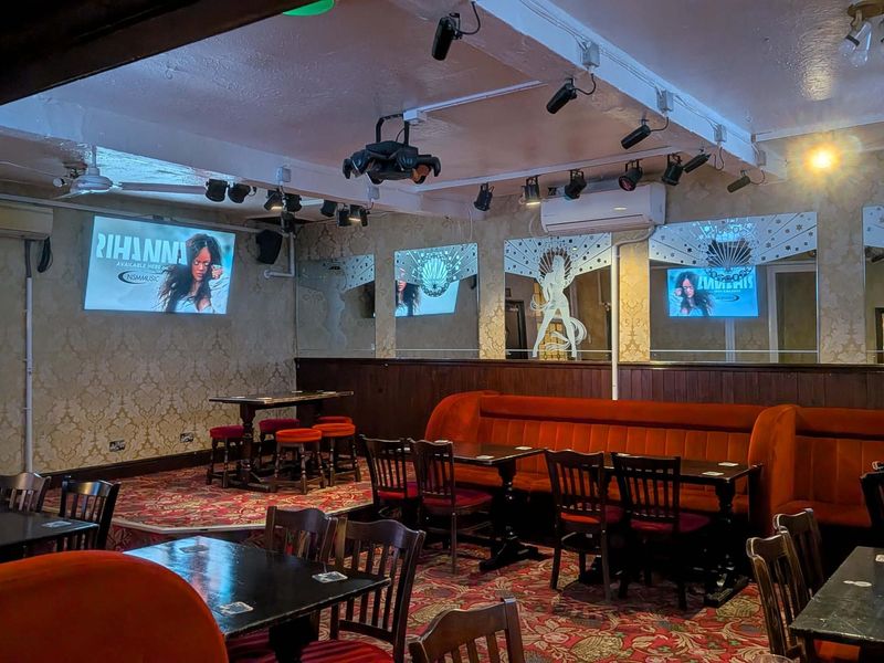 Seating area and stage. (Pub). Published on 19-05-2026 