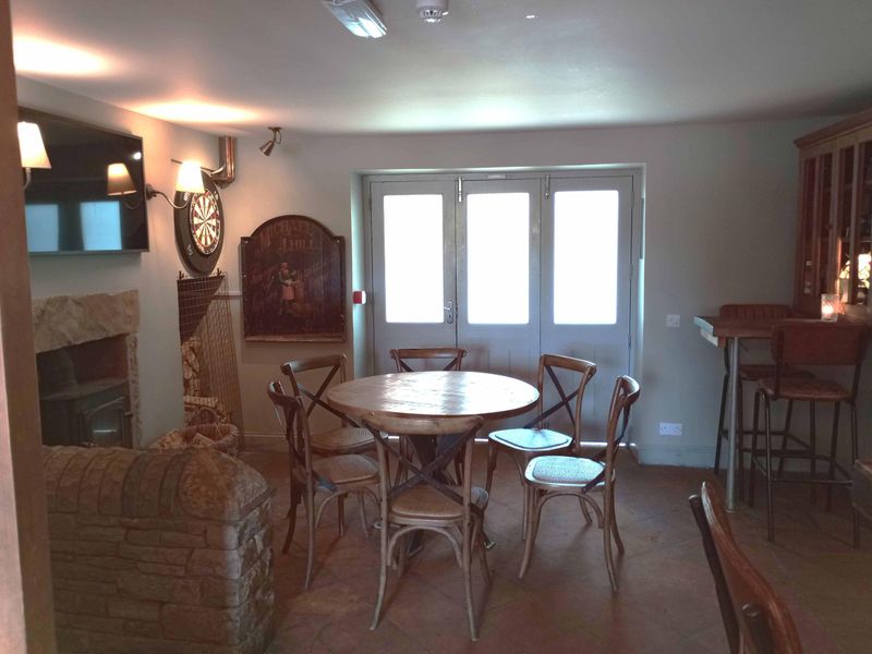 Seating area with dart board. (Pub). Published on 21-10-2025 