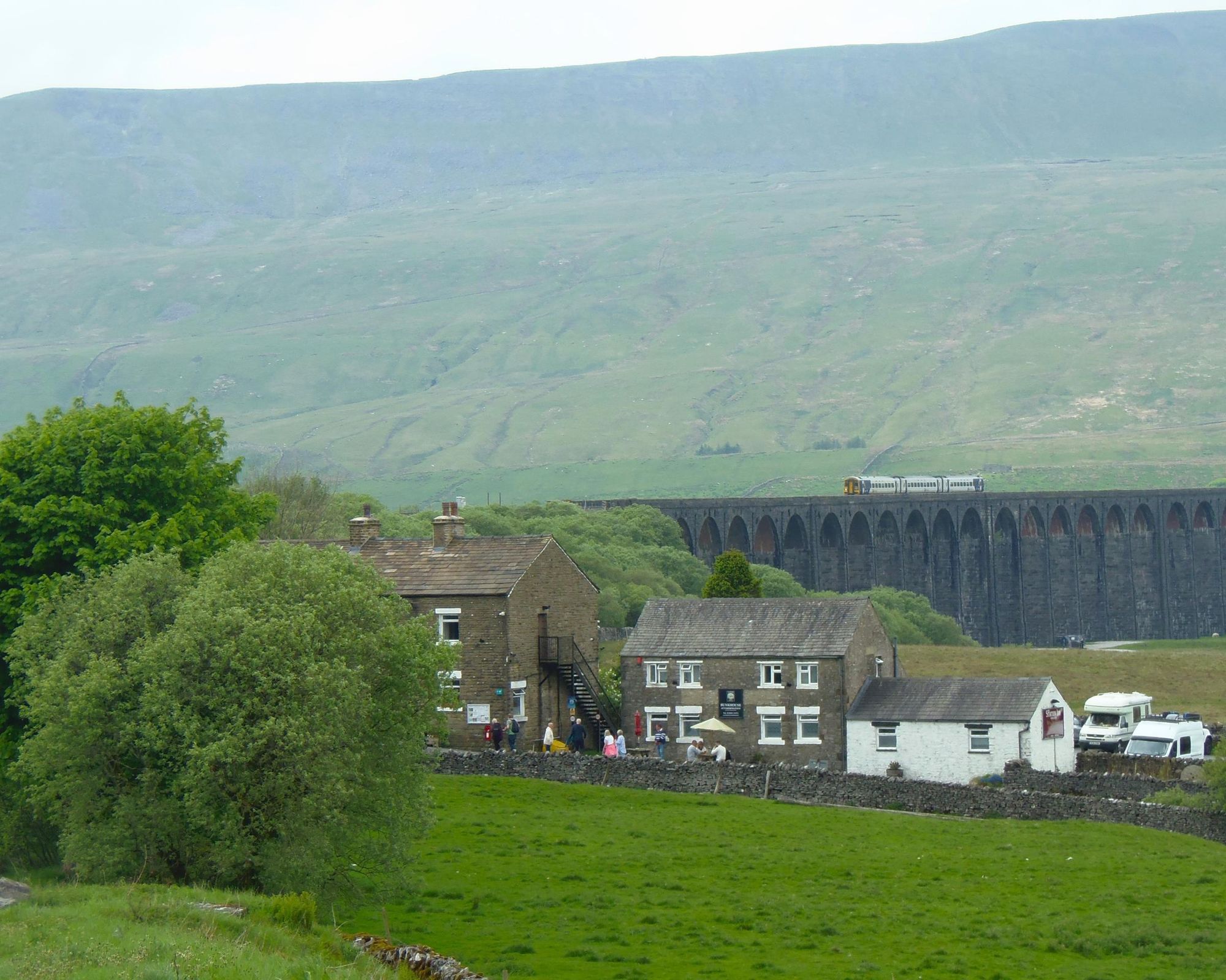 Whernside and Ribblehead Viaduct behind pub and Bunkhouse May 20. (External). Published on 05-03-2025