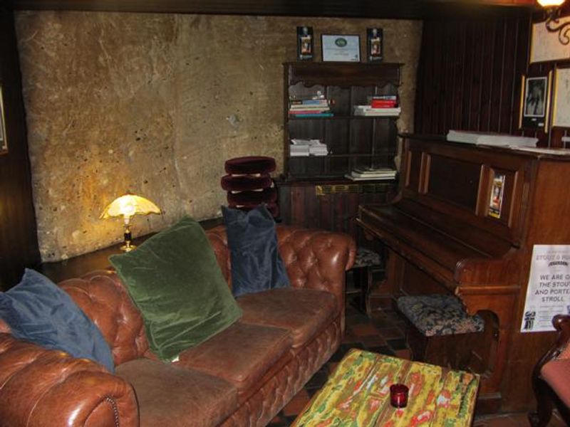 Seated area along with piano. (Pub). Published on 25-03-2014 