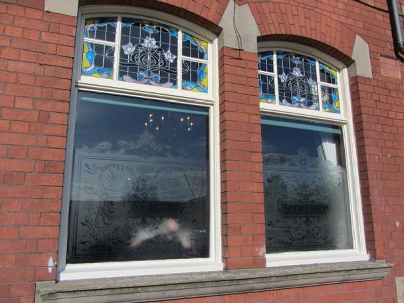 Etched windows with stained glass uppers. (Pub, External). Published on 28-04-2014