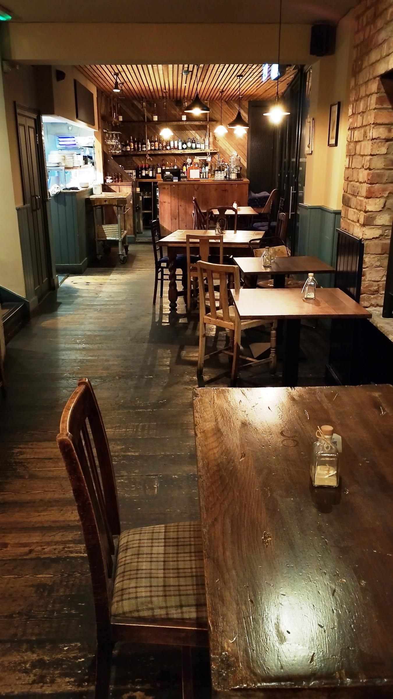 Downstairs area with open kitchen on left and bar straight ahead. (Pub). Published on 22-10-2025