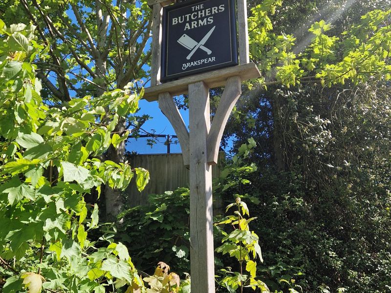 Butcher's Arms SC - Pub sign by garden gate - Apr 2026. (Sign). Published on 15-05-2026 