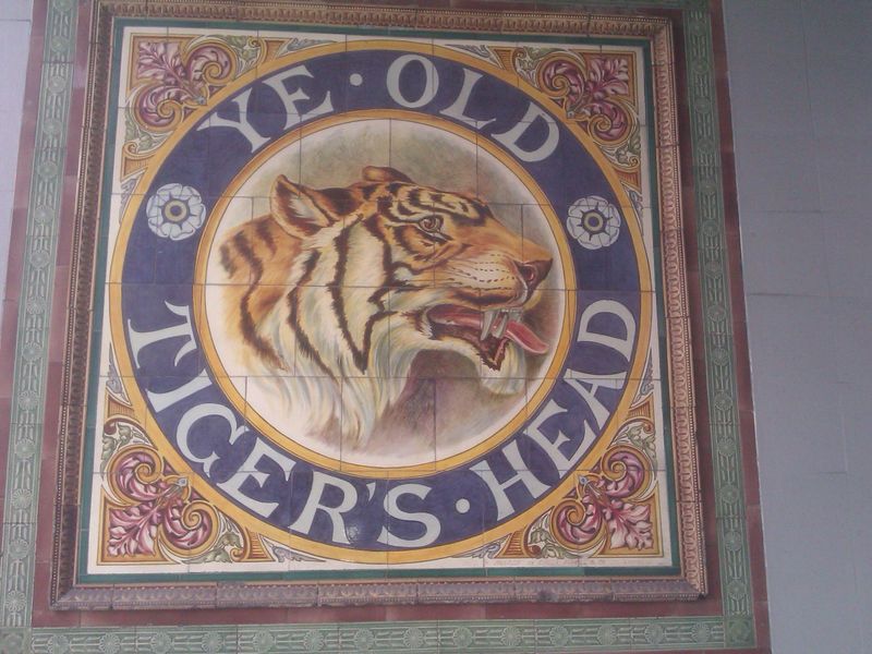 The tiled tiger's head mural in the front porch. (Sign). Published on 03-07-2024