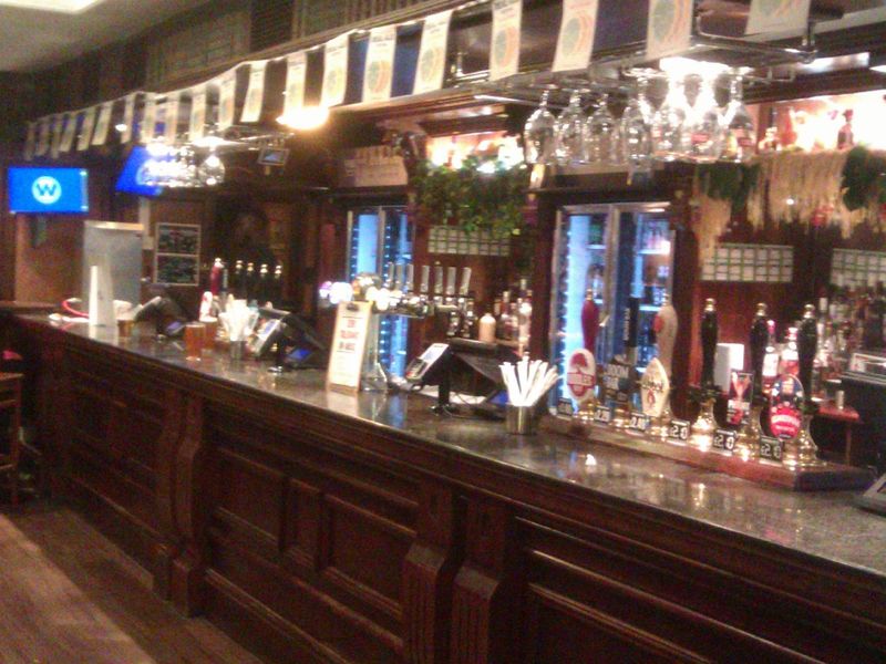 Bar counter and handpumps. (Pub, Bar, Customers). Published on 23-10-2022 