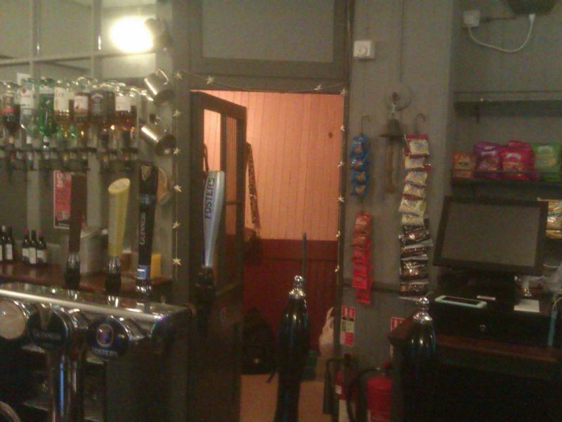 Open door shows wooden cladding on windmill behind. (Bar). Published on 16-07-2024 