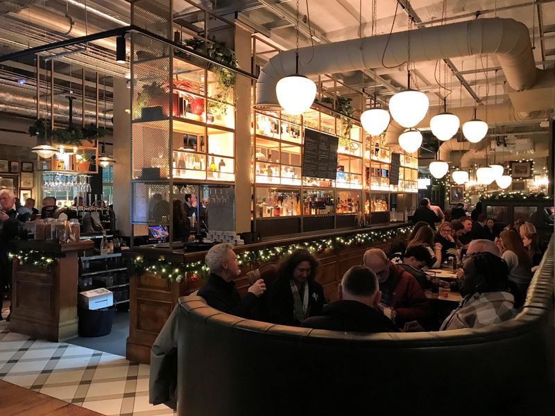Interior of the pub behind the bar area, 2026. (Pub, Bar, Customers). Published on 30-04-2026 