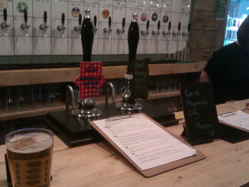 Handpumps and keg taps behind. (Bar). Published on 23-09-2022 
