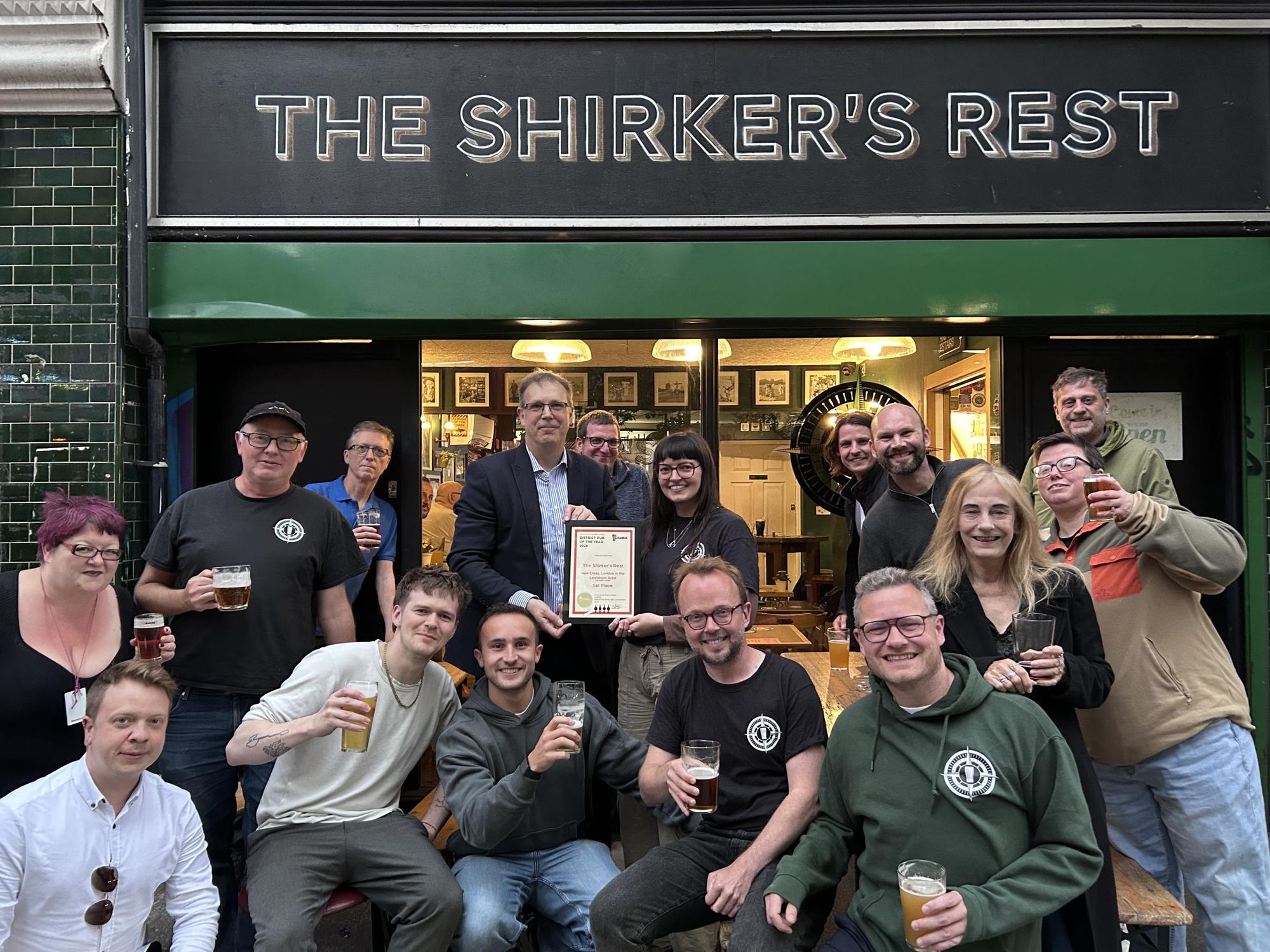 Staff being awarded the 2026 District Pub of the Year award. (Pub, External, Publican, Branch, Key). Published on 04-06-2026
