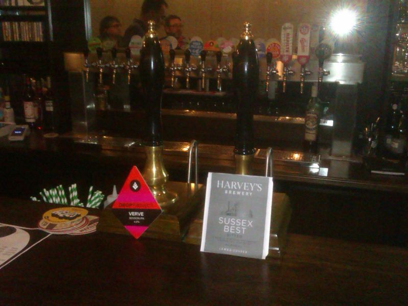 Two handpumps on counter, keg taps on wall behind. (Pub, Bar). Published on 24-07-2024