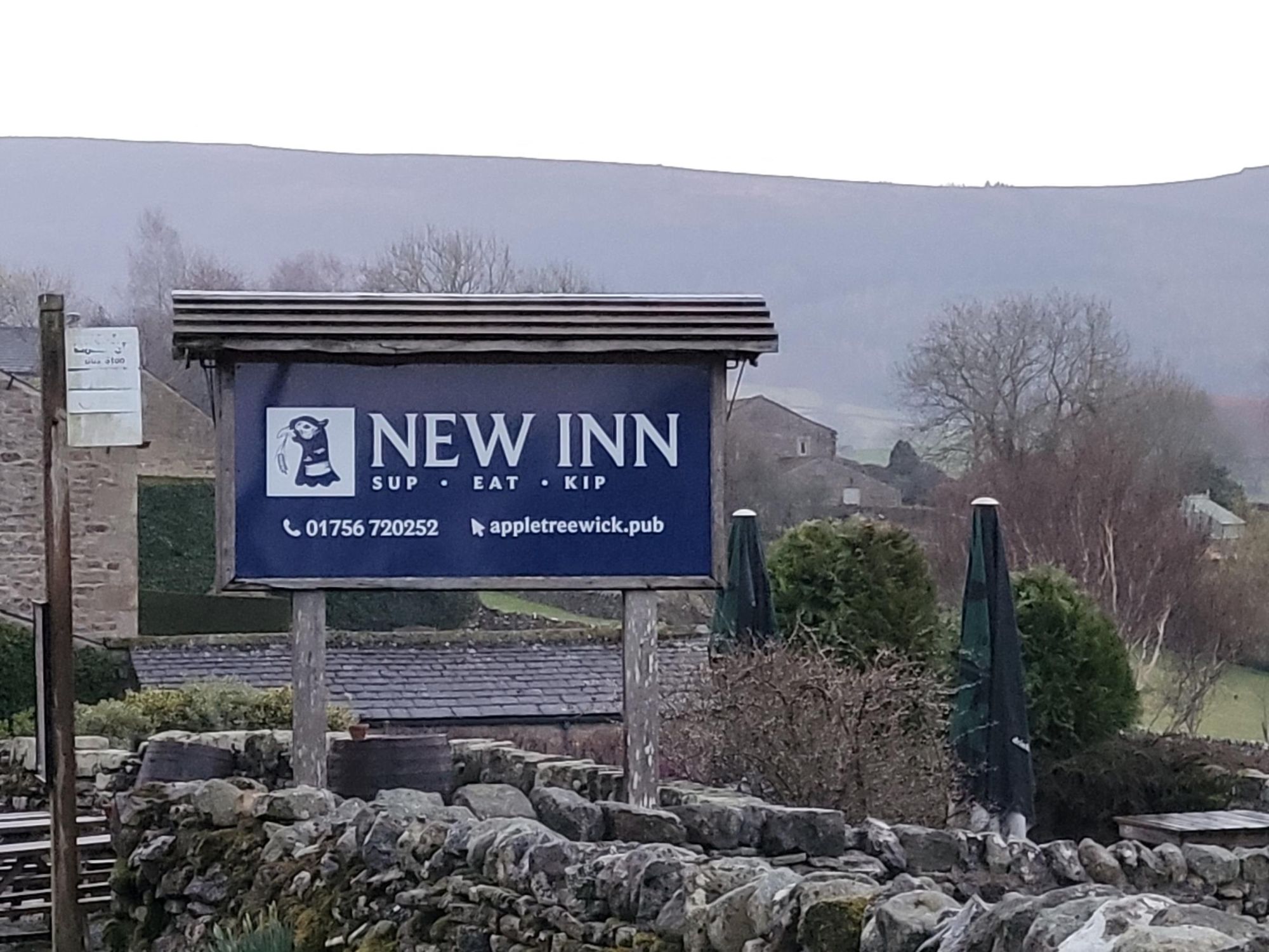 New Inn, Appletreewick - pub sign at the bus stop - March 2025. (Sign). Published on 23-03-2025
