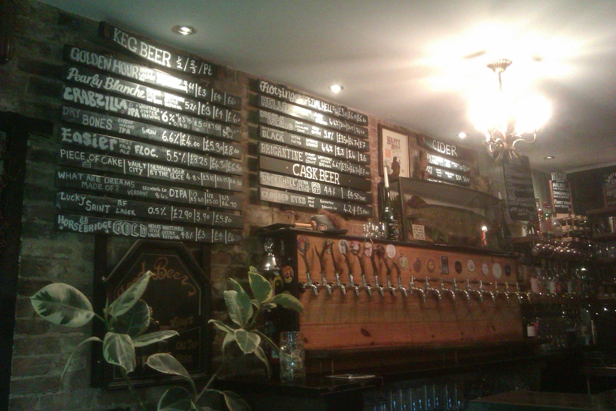 Beer menu and the wall of keg taps. (Bar). Published on 22-08-2024