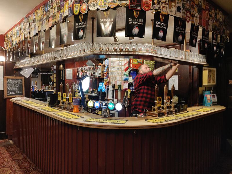 The guv'nor keeping the pub neat and tidy. (Pub, Bar, Publican). Published on 26-02-2023 