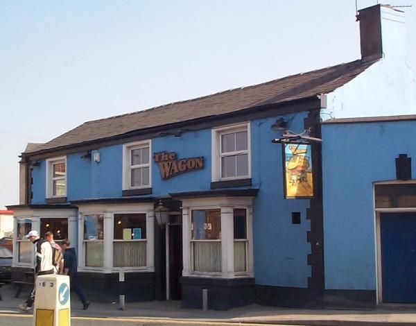 sign now replaced with 3 wall-mounted  wagon wheels. (External). Published on 17-05-2013