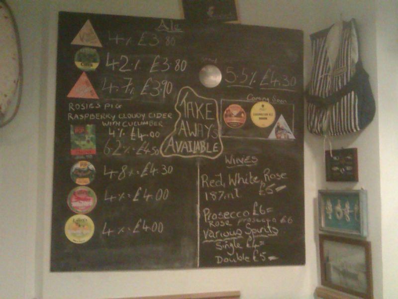 The cask ale and cider menu and price list chalk board. (Bar). Published on 10-12-2023