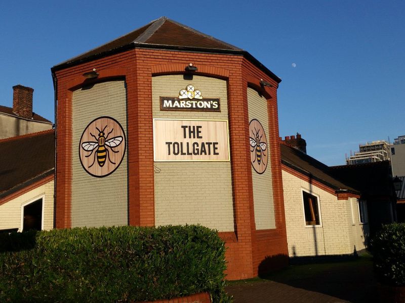 The Tollgate's rather stark exterior, on a sunny evening in 2023. (Pub, External). Published on 01-06-2023 